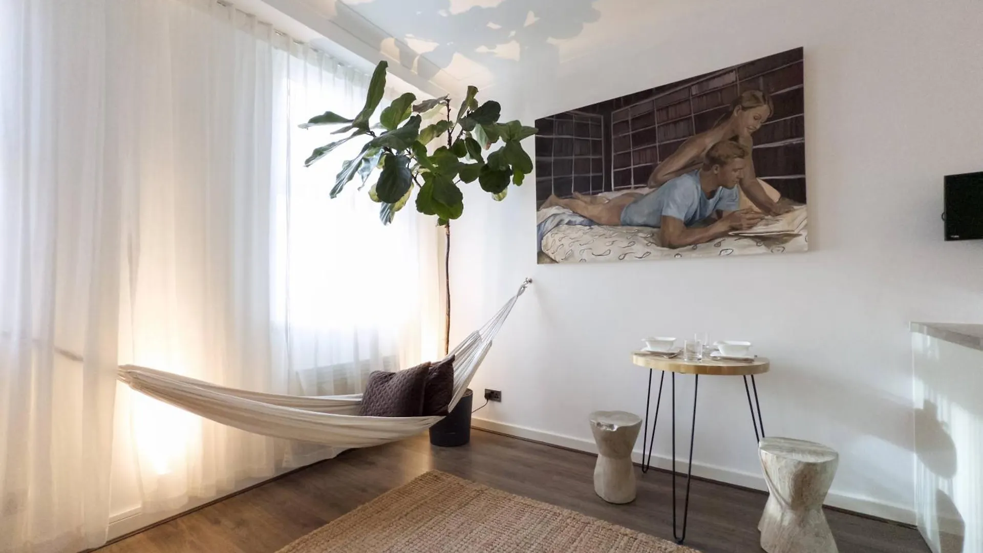 Tranquil Oasis W 100Inch Cinema & Hammock, By The Design Traveller Apartment London United Kingdom