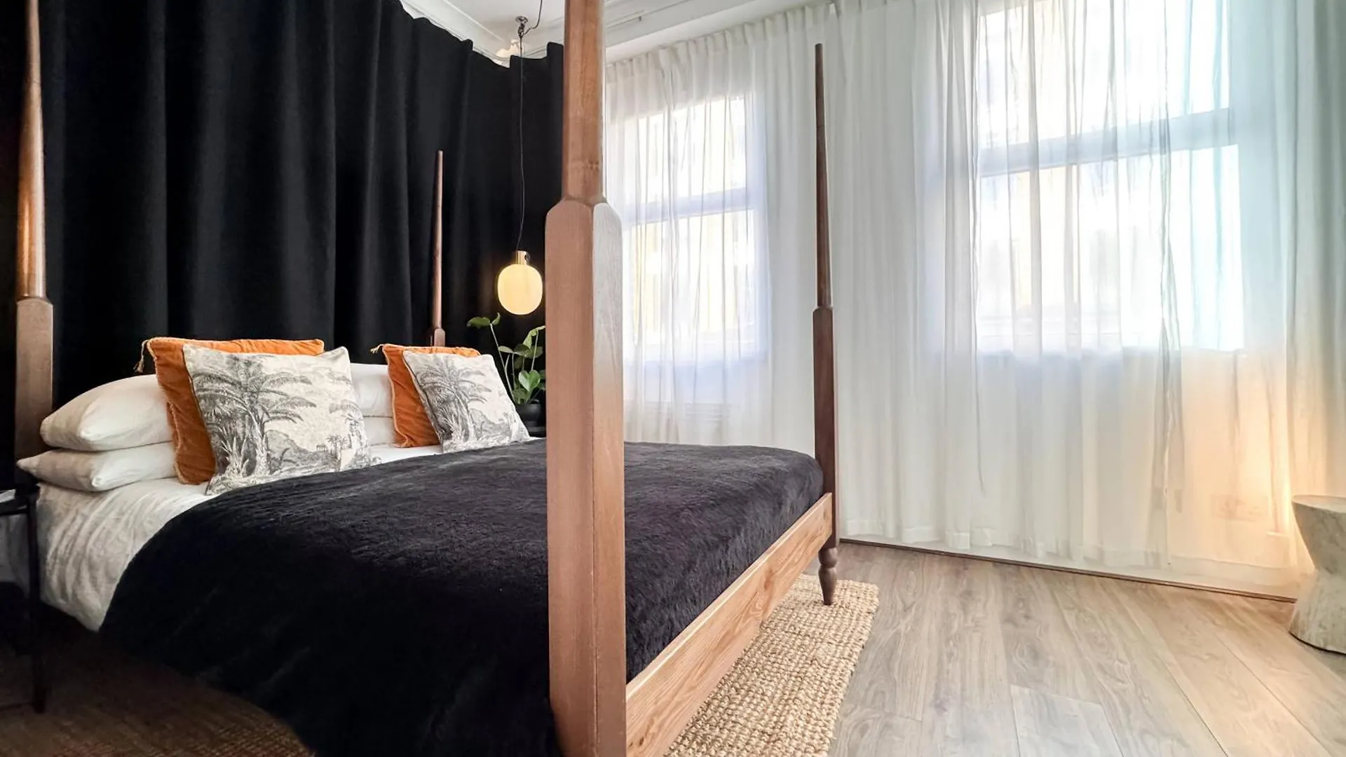 Tranquil Oasis W 100Inch Cinema & Hammock, By The Design Traveller Apartment London
